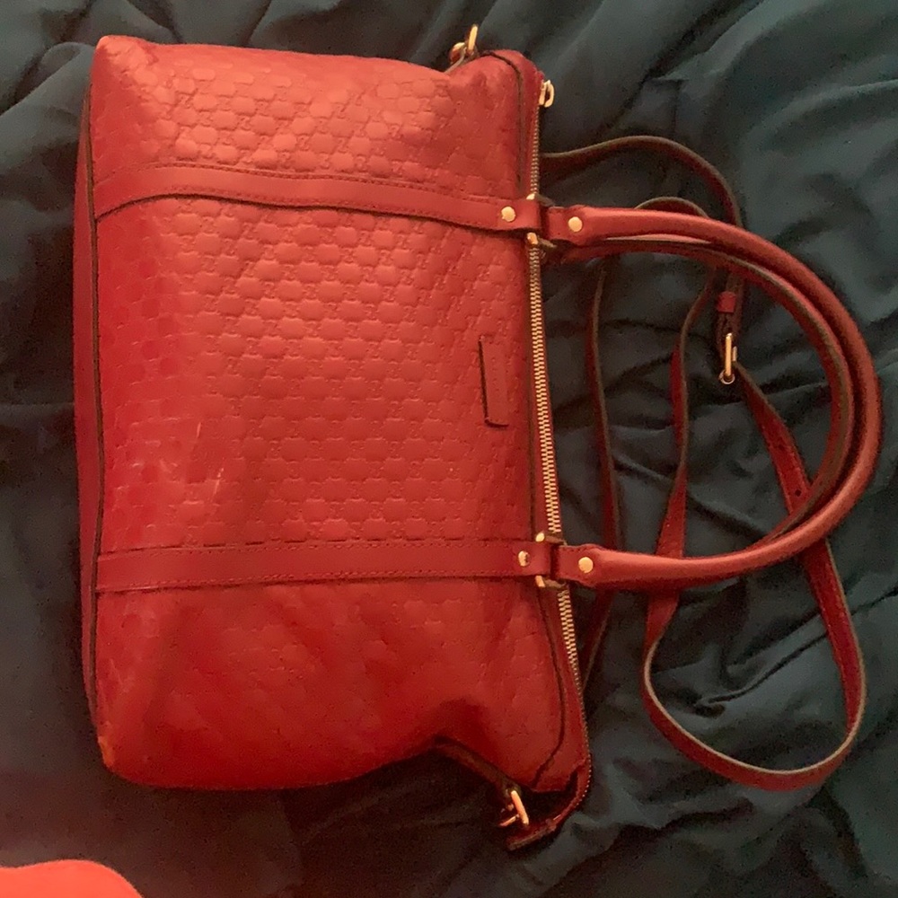 Red Gucci’s hand bag